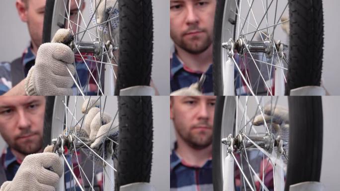 自行车的维修和保养。男性修理工用扳手拧紧轮毂轴上螺母的特写镜头。安装自行车的前轮。