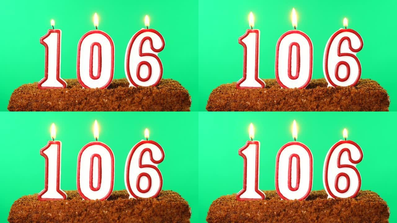 蛋糕与数字106点燃的蜡烛。色度键。绿屏。隔离