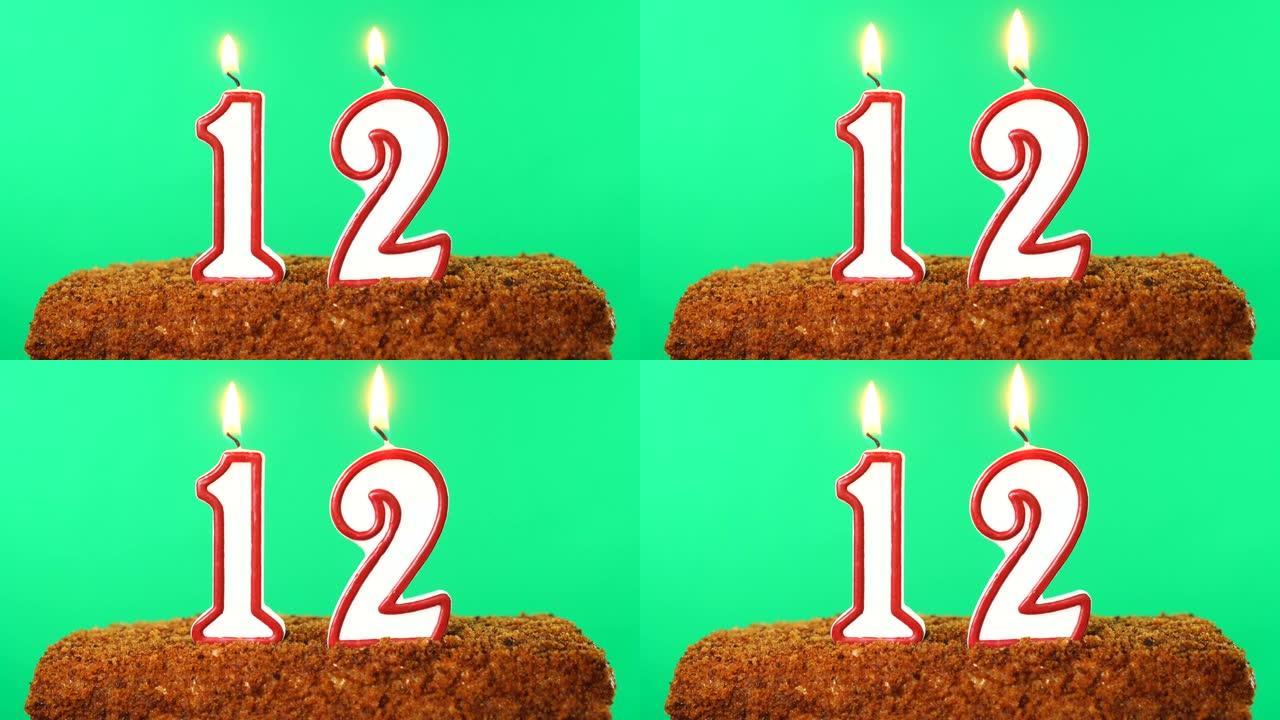 用12号点燃的蜡烛蛋糕。色度键。绿屏。隔离