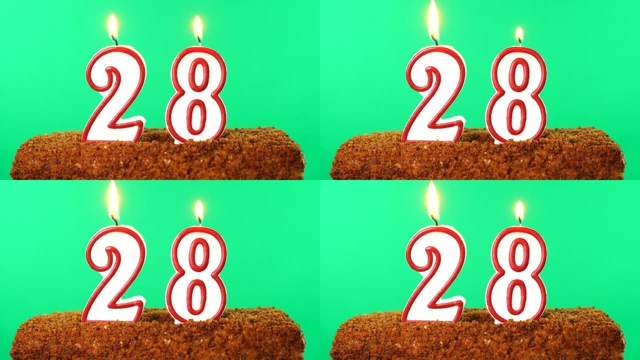 用28号点燃蜡烛的蛋糕。色度键。绿屏。隔离