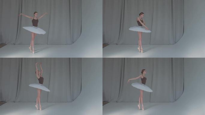 一位年轻的有前途的芭蕾舞演员正在跳古典芭蕾舞。在宽敞明亮的工作室拍摄，背景为窗帘。慢动作
