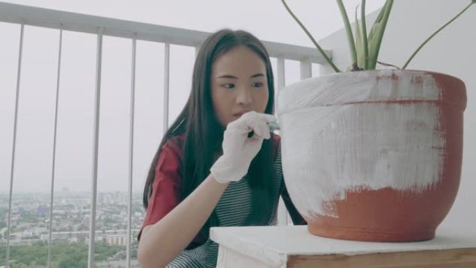 泰国年轻女子绘画树盆-股票视频