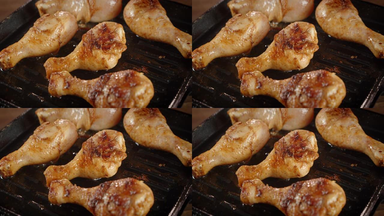 鸡腿在煎锅里用热油油炸。