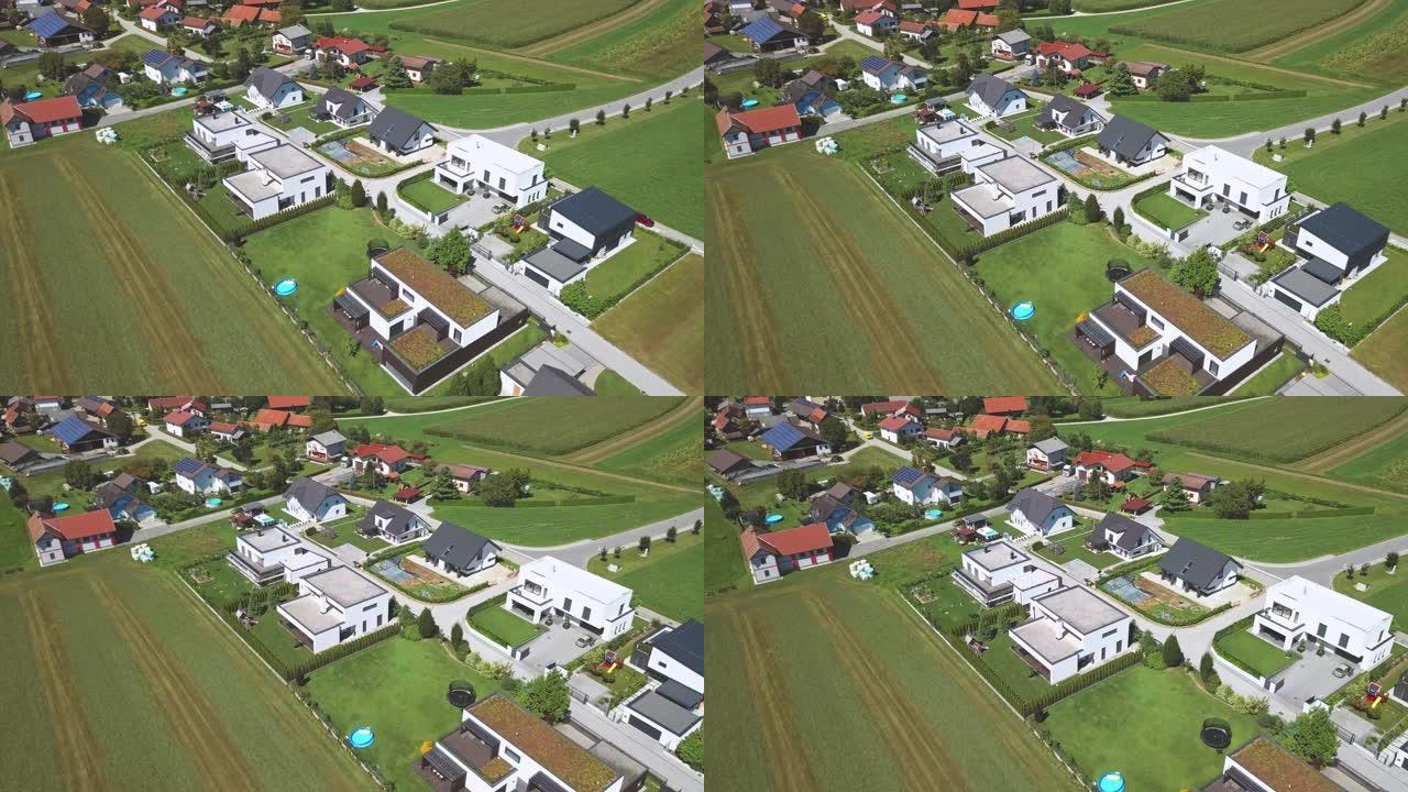 周围有农田的新型现代单身家庭住宅的鸟瞰图