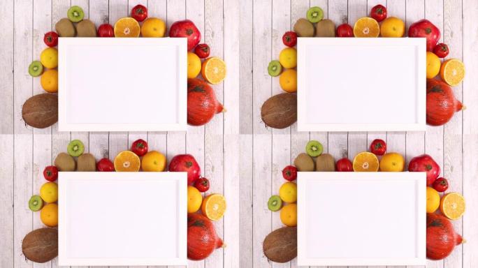 白色框架，在框架下放置文本和移动水果和蔬菜。停止运动