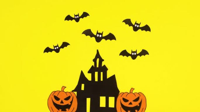 万圣节蝙蝠从令人毛骨悚然的恐怖之家出来，飞过房子。停止运动