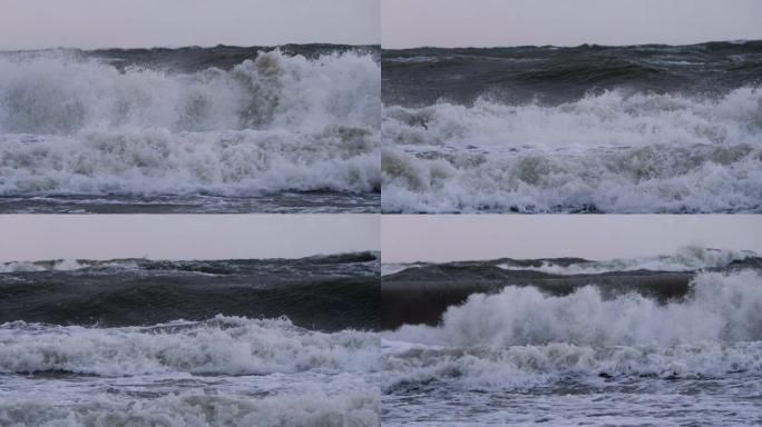 极大的海浪撞击海岸，太平洋美丽的海浪。超级慢动作。风暴期间的海浪。强大的海上热带飓风。全球变暖。恶劣