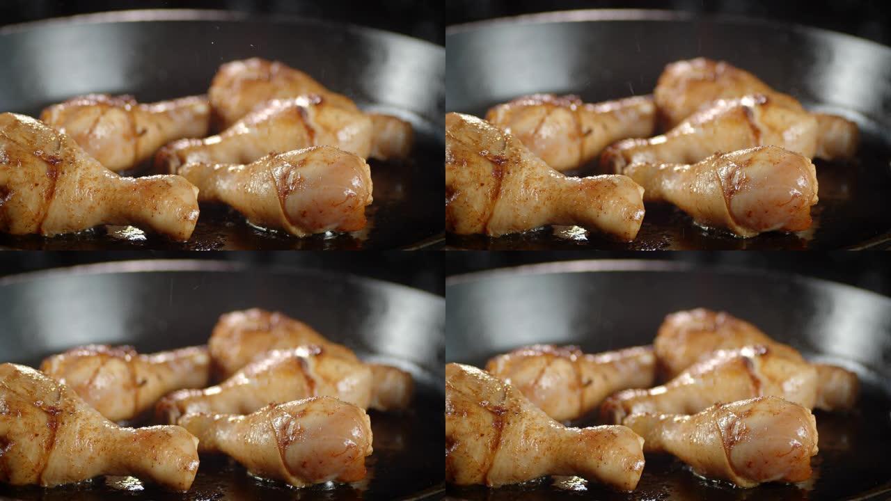 鸡腿在煎锅里用热油油炸。