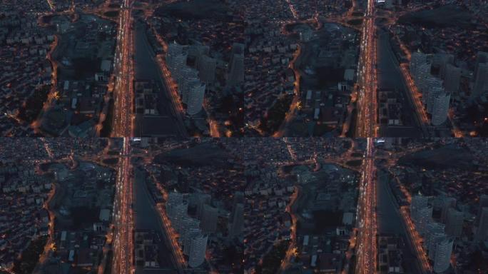 伊斯坦布尔金融区城市夜间的长高速公路或高速公路无尽的介绍交通拥堵和红灯的距离，鸟瞰图