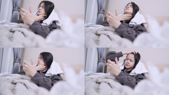 亚洲病人躺在毯子床单里用手机，在家里卧室发热时上网，咳嗽喉咙飙升症状，电晕病毒新型冠状病毒肺炎，用过