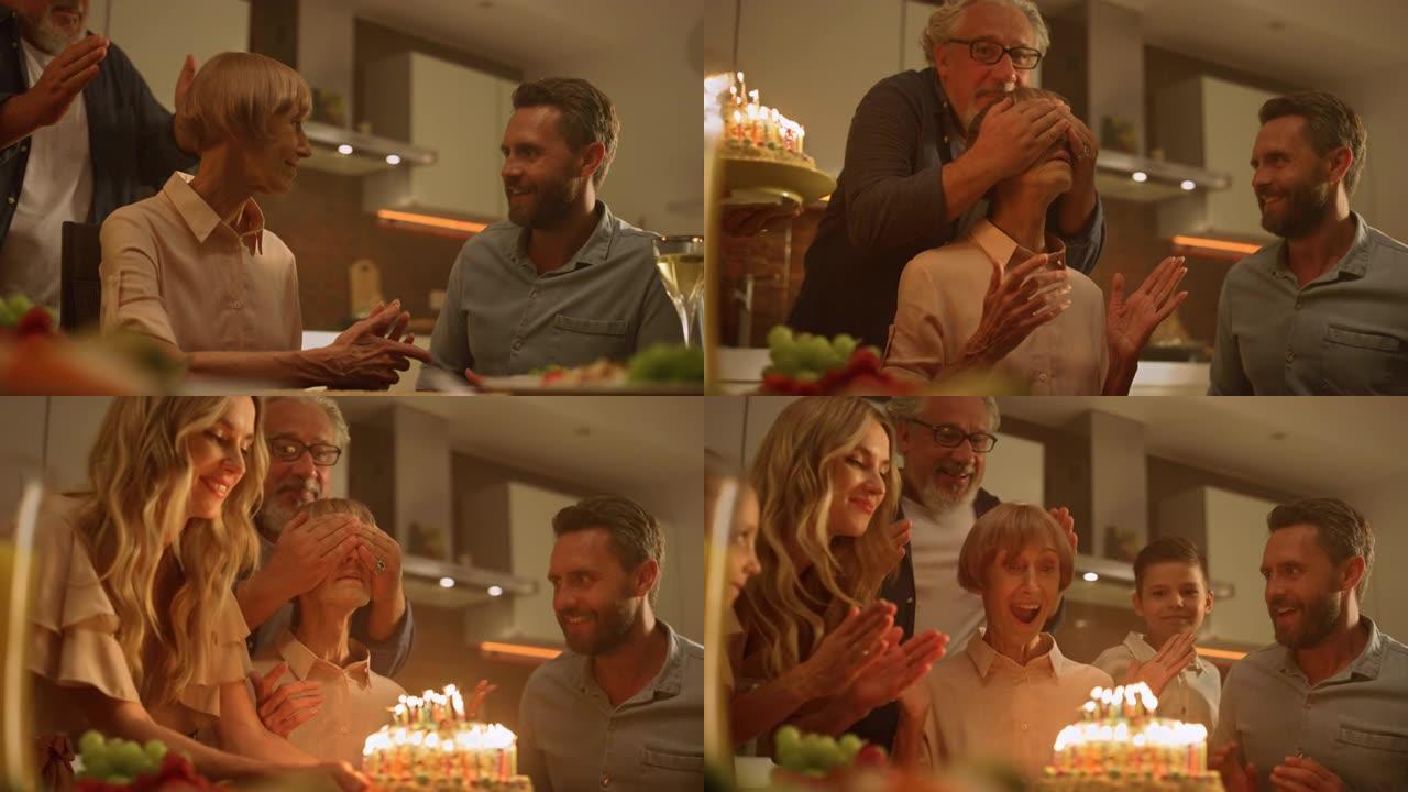 家人在生日为祖母带来惊喜。看着蛋糕的高级女人
