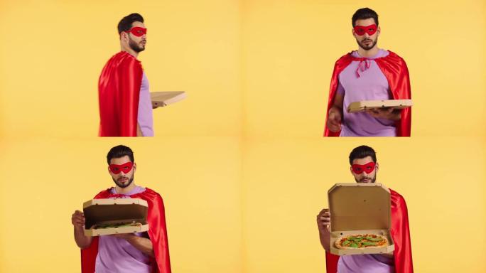 超级英雄开盒，比萨饼隔离在黄色上
