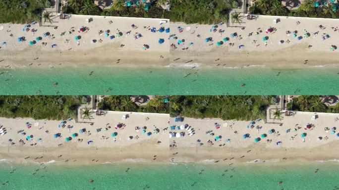 人们在迈阿密海滩上度过美好时光的空中4k镜头