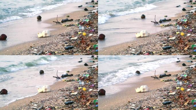 海上日落，塑料橡胶和废物留在海滩上，海浪将它们吹入大海2