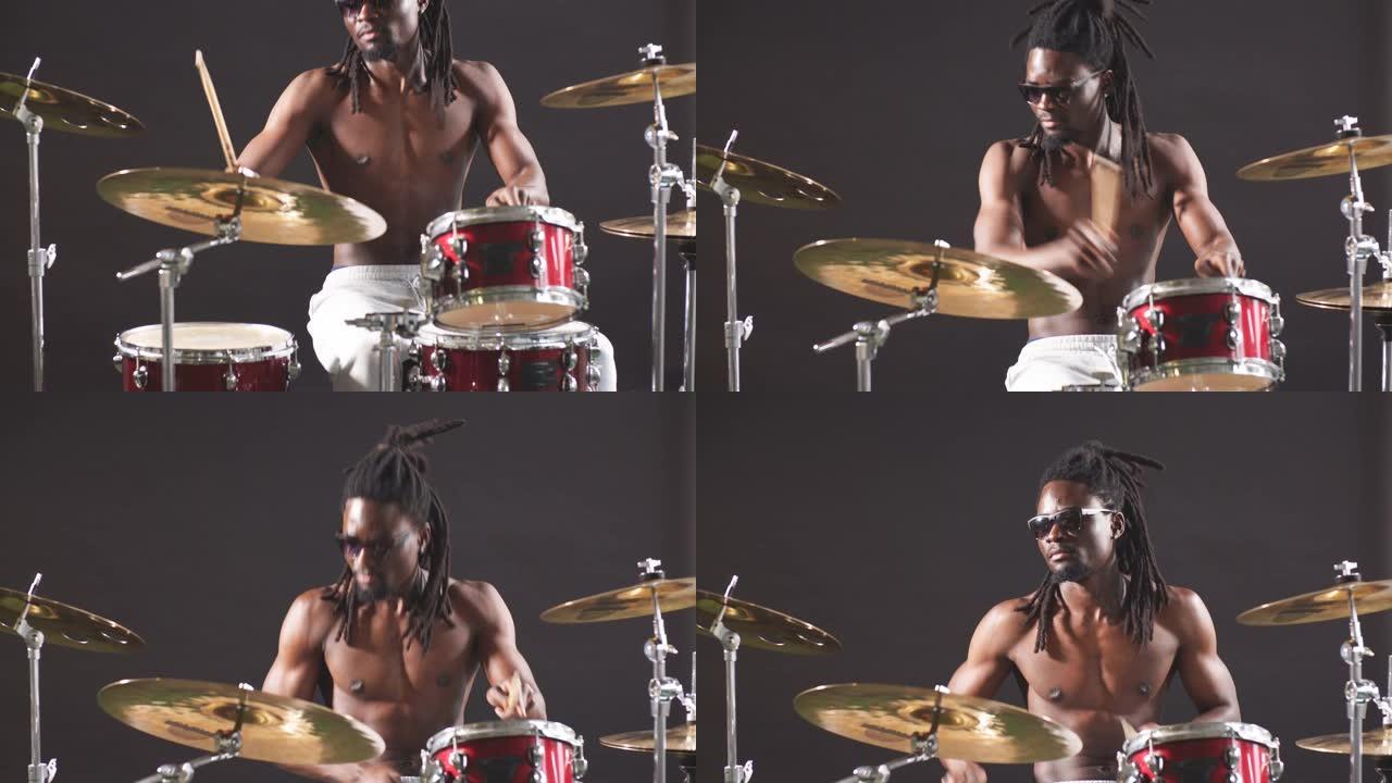 好看的艺术非洲黑人男性鼓手喜欢打鼓
