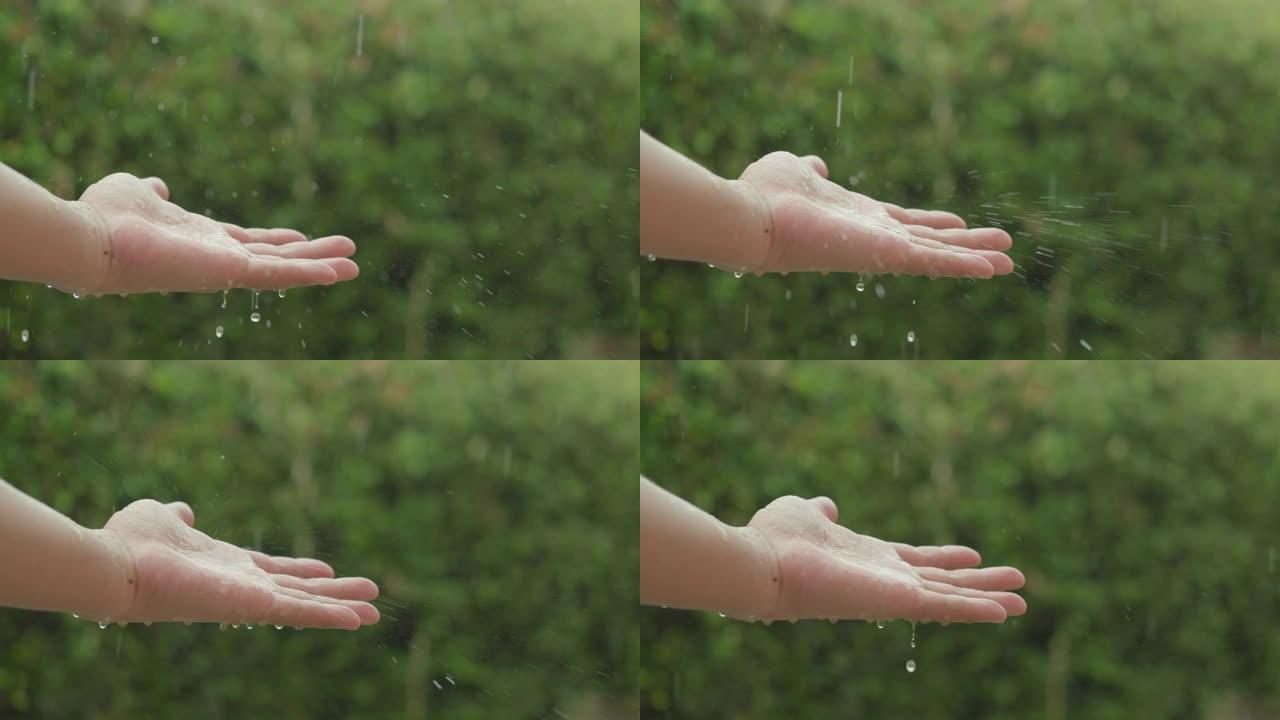 慢速视频将雨水落到人的手中