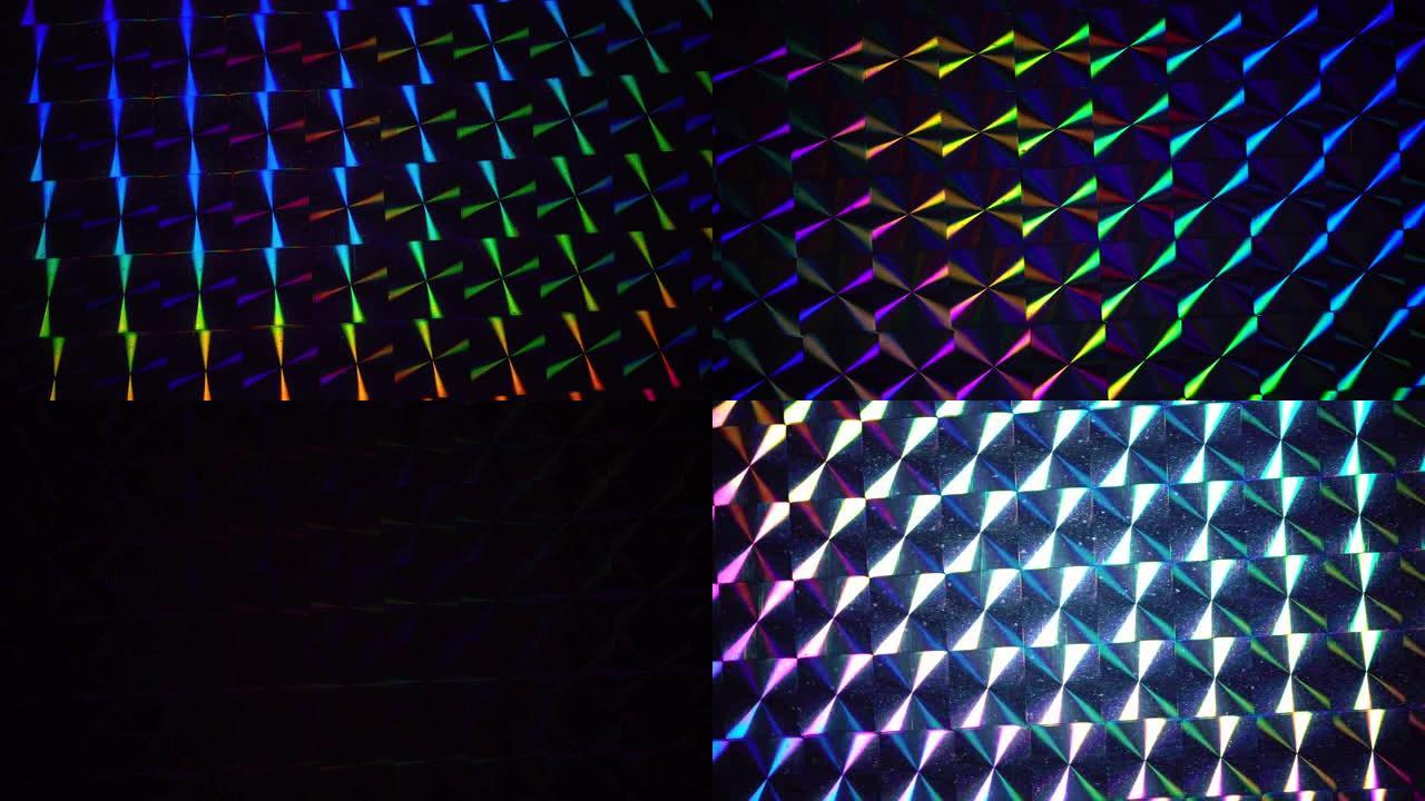 真正闪亮的发光二极管灯在银色彩虹全息箔上移动