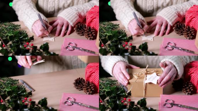 女人在可重复使用的木制礼品标签上书写环保圣诞礼物