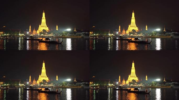 黎明神庙Wat Arun，与泰国国王在泰国曼谷市中心附近的湄南河上的皇家驳船游行。泰国建筑背景。大型