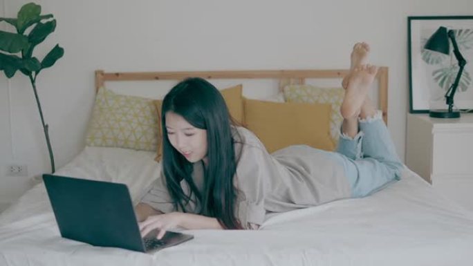 亚洲妇女在床上工作-股票视频