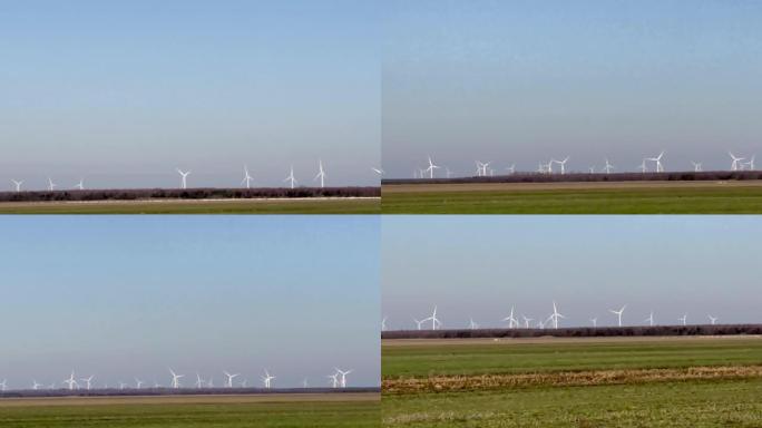 野外的风力涡轮机和苔原天鹅