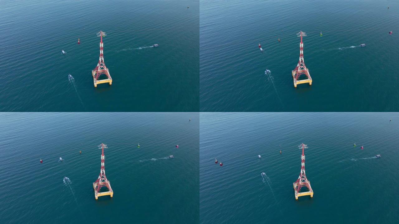 空中慢镜头拍摄了一辆缆车在海上，一些船漂浮在