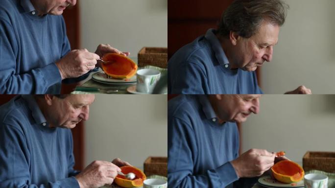 早上吃木瓜水果的老人