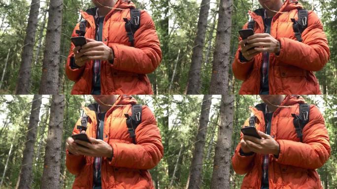 年轻人在树林里用手机