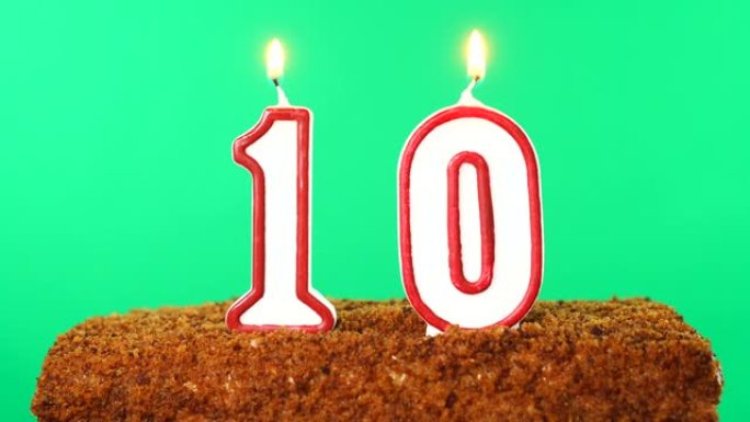 10号点燃蜡烛的蛋糕。色度键。绿屏。隔离