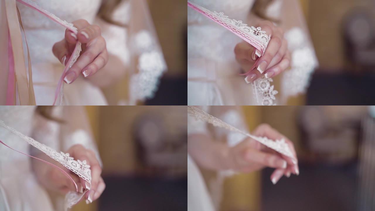 年轻的女孩正在玩编织成一束鲜花的丝带