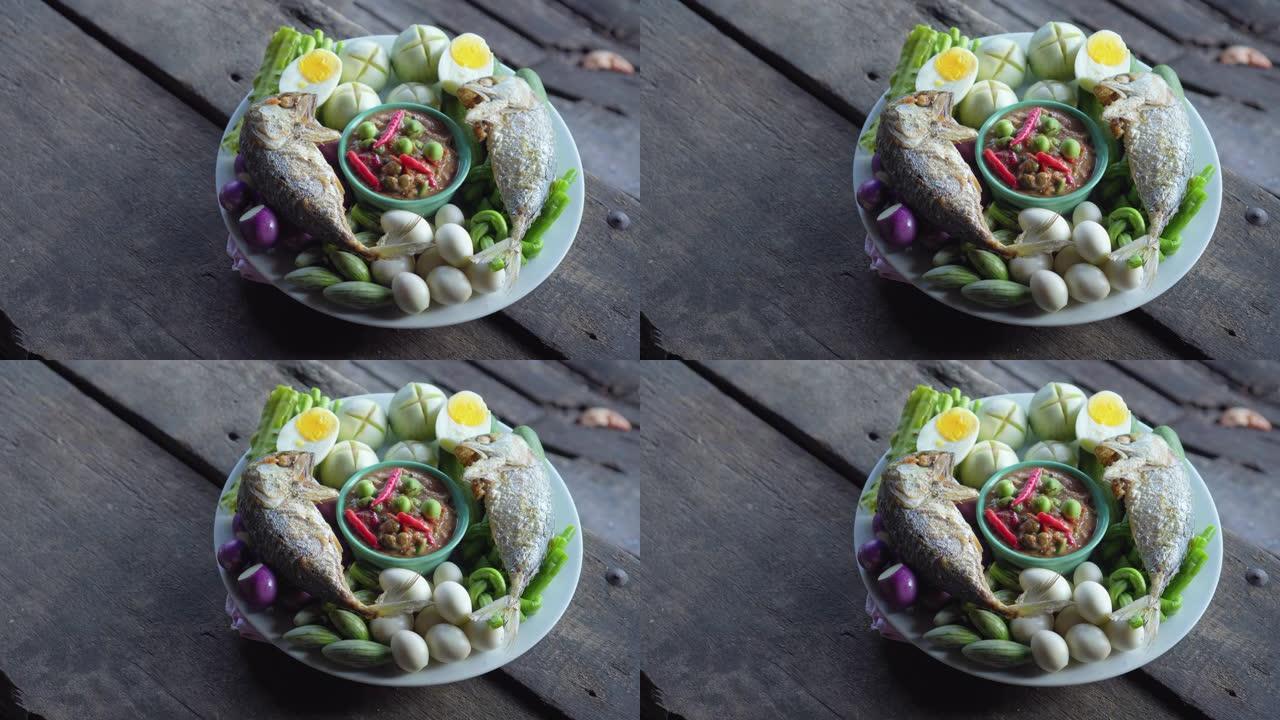 盘炒鲭鱼配虾酱酱和蔬菜。泰国菜。潘开枪。4K