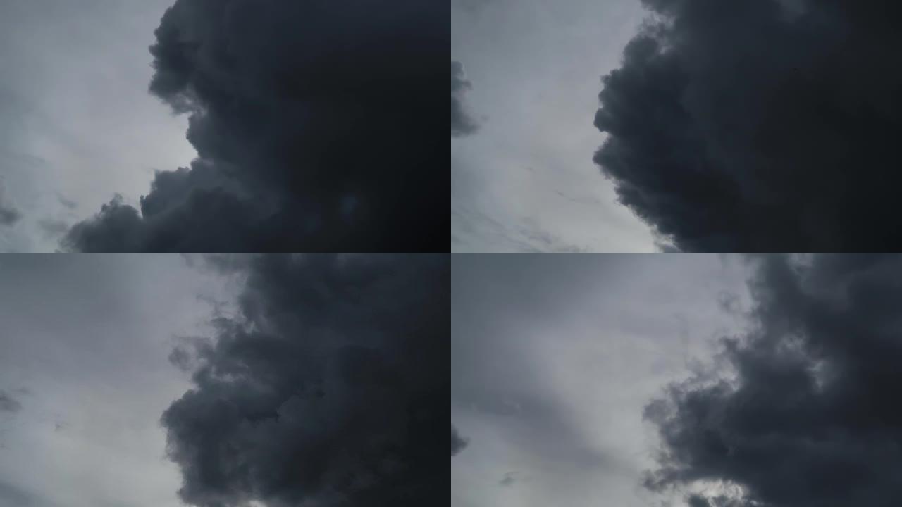 可怕的深灰色和黑云在飓风来临前在令人毛骨悚然的天空地平线上缓慢移动