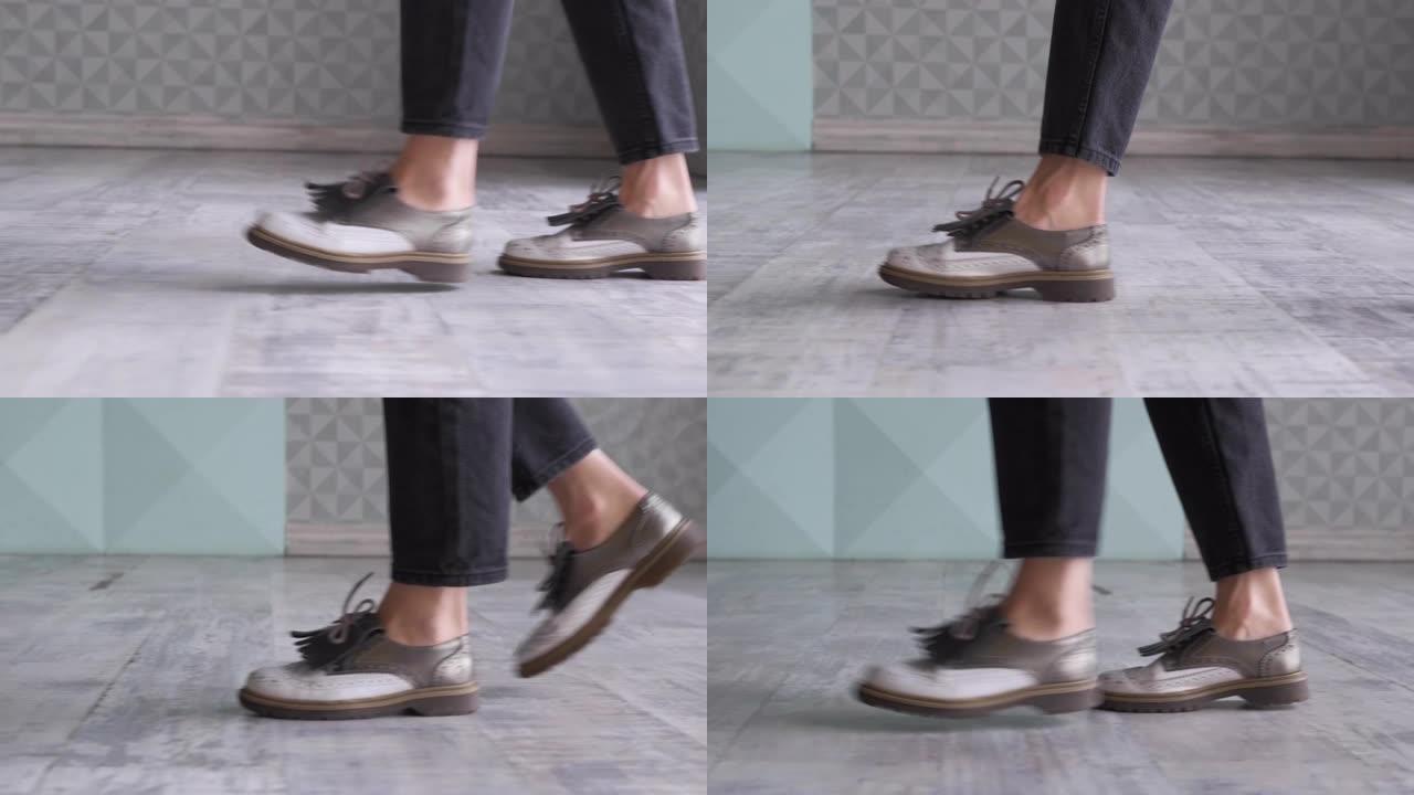 女人穿着鞋子的脚走在地毯地板上的侧视图。穿着米色鞋子的女性腿在长廊上行走的特写