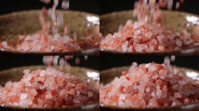 粉红盐慢动作掉进碗里，喜玛拉雅粉红盐特写