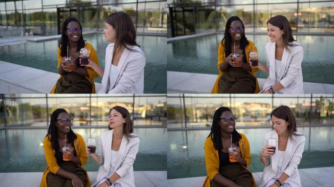 在办公楼前休息的女商人