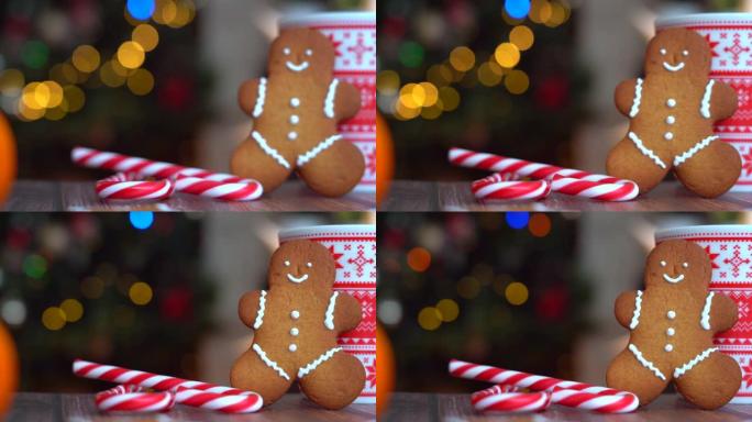 圣诞视频姜饼人红色马克杯，圣诞装饰品上有圣诞圣诞树和红色条纹节日糖果。圣诞糖果和木底棉花糖杯子。4k
