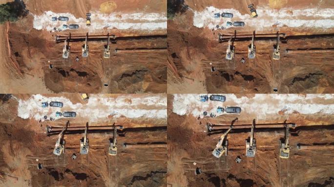 挖掘机在施工现场手持大管线，航拍