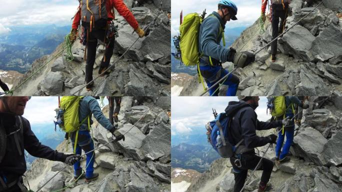 男人正在爬到山顶