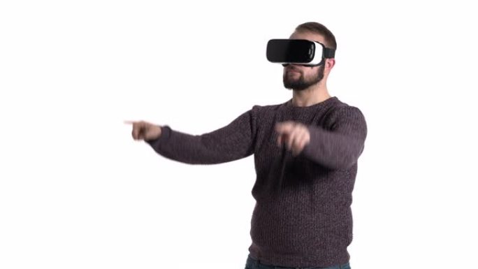 一个男人戴着现代VR眼镜在空中画假想的正方形的特写镜头。酷高科技设备使用概念