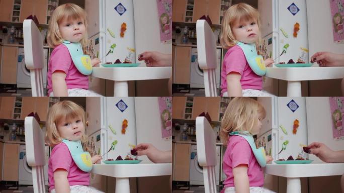 两岁的金发碧眼的小女孩在用餐，4k拍摄
