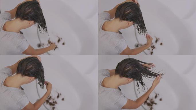 头发问题。洗漱时女孩的头发掉进水槽里。