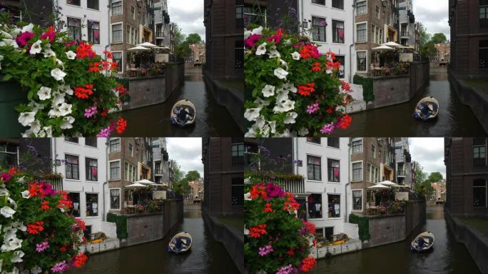 阿姆斯特丹市中心运河交通桥花卉慢动作全景4k荷兰