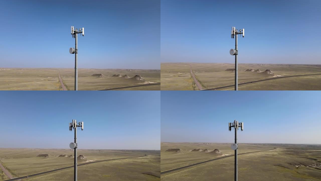 孤零零的手机塔高高耸立在平坦的贫瘠景观之上 (空中4k视频)