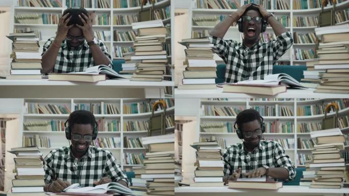 紧张的非洲年轻人在耳机中学习，并开始在时尚的图书馆中尖叫