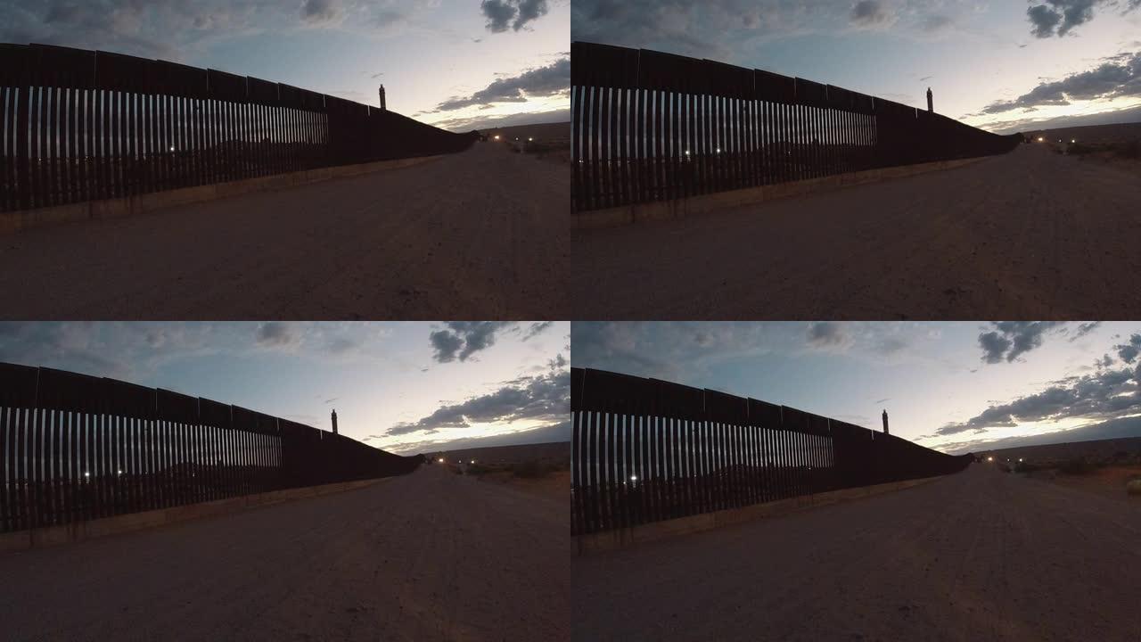 日落时分，分隔墨西哥埃尔帕索和华雷斯城的国际边境墙的视频