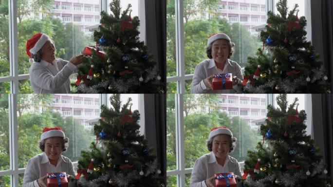 戴红帽子的老年妇女赠送礼盒，并在客厅说 “新年快乐” 和 “圣诞节”