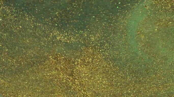 金色和深绿色液体闪光漆纹理宏。液体闪亮背景
