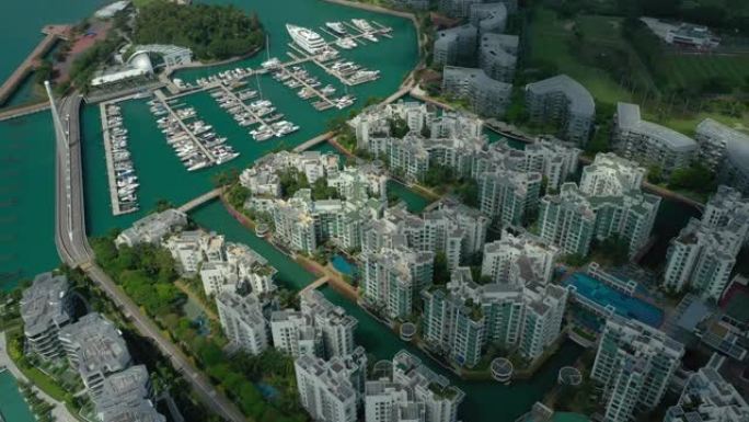 阳光灿烂的新加坡城市公寓海湾综合游艇码头码头航空全景4k