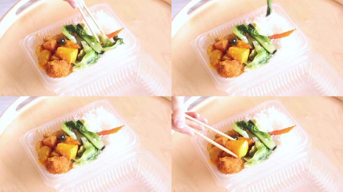 午餐时吃健康餐吃中国筷子