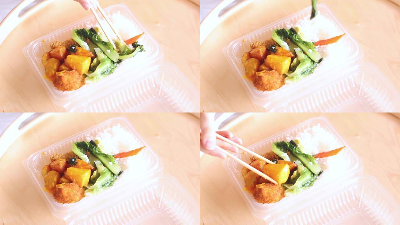 午餐时吃健康餐吃中国筷子